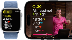 Un Apple Watch che mostra i parametri di un allenamento e un allenamento Apple Fitness+ in corso, sul display di un iPhone
